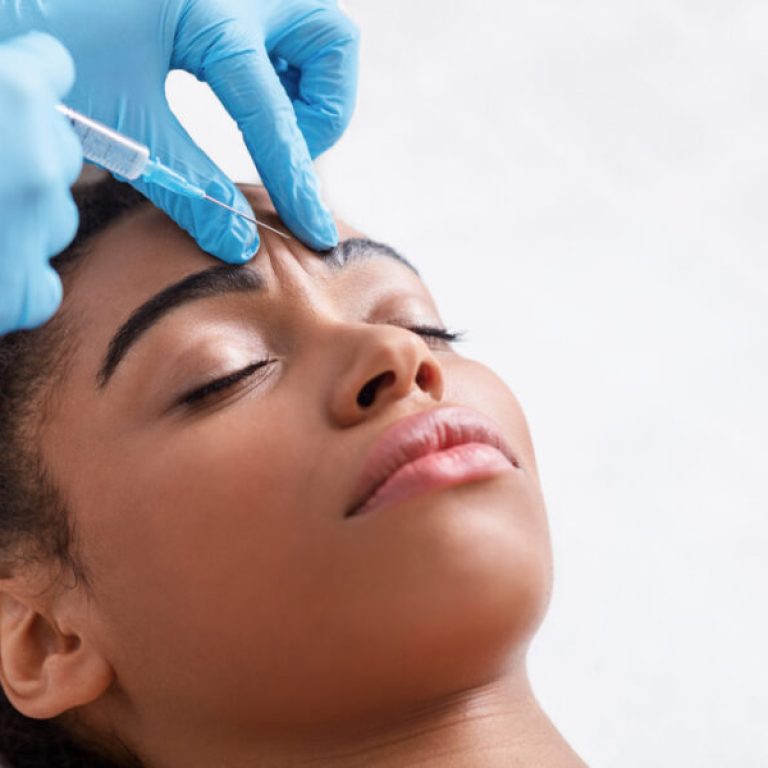 Plastic,Surgery.,Young,African,Woman,Receiving,Botox,Injection,In,Interbrow